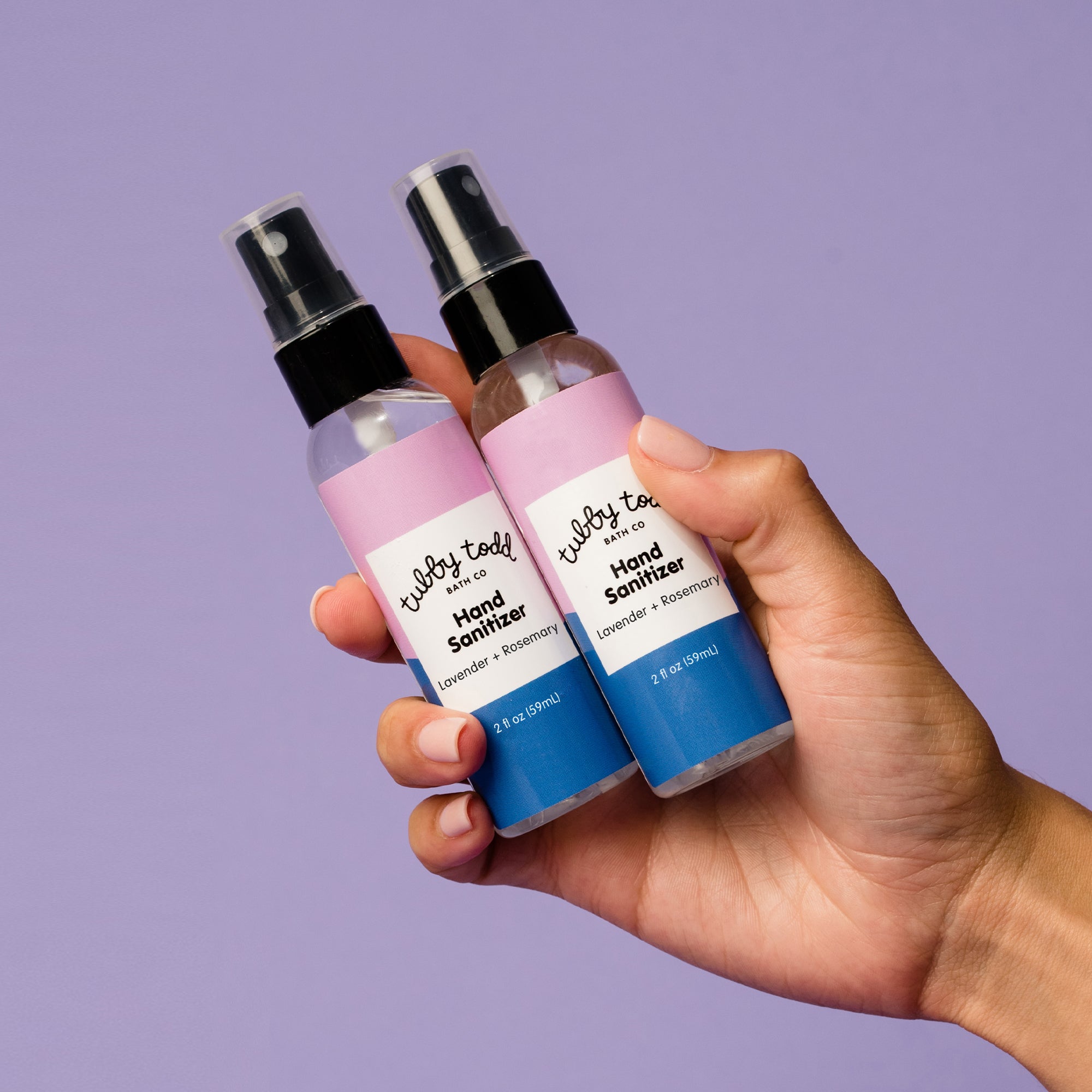 Hand holding Hand Sanitizer 2pack